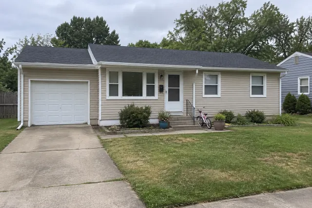 Modest beige ranch home before repainting
